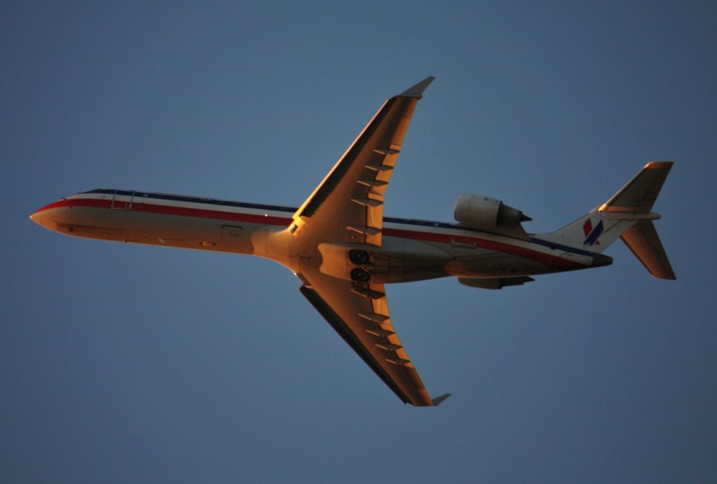 Canadair Regional Jet CRJ-700 (N506AE) - American  Eagle  departing 24L at sunset
