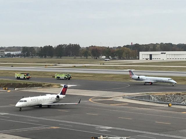 UNKNOWN — - Watching from parking garage as emergency vehicles meet American Airlines flight at Port Columbus John Glenn International Airport, Columbus, OH., 10/25/2019 at 10:30am. 