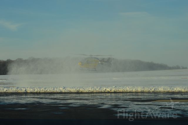 KAWASAKI EC-145 (N262MH) - Metro Lifeflight 3 rotor wash while landing at Wayne County Airport (KBJJ).