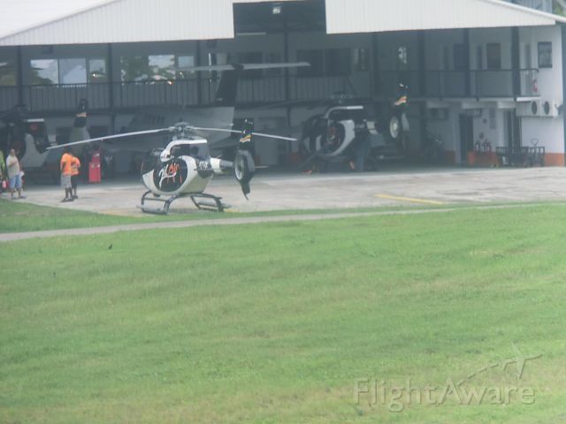— — - A mix of aircraft can be appreciated at the Zil Air hangar in the Seychelles.  The company specializes in island hopping and transfers In the background is a Eurocopter.