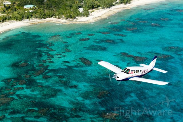 Piper Cherokee Arrow (N2831T) - I was flying in formation with a Bonanza over Cat Island Bahamas near New Bight airport. AOPA photographer Mike Fizer took the pic. 