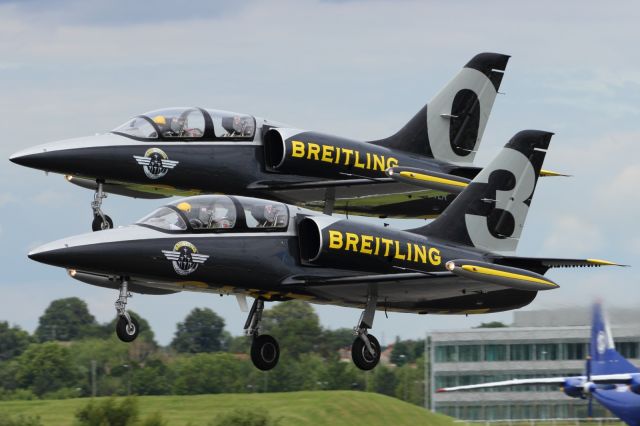 Aero L-39 Albatros — - L39's of the Breitling Jet Aerobatic Team get airborne at Farnborough 2012.