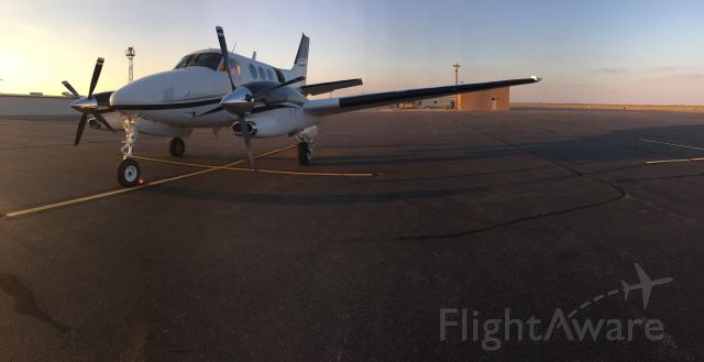 Beechcraft King Air 90 (N87HB) - Sun setting, waiting to go fly.