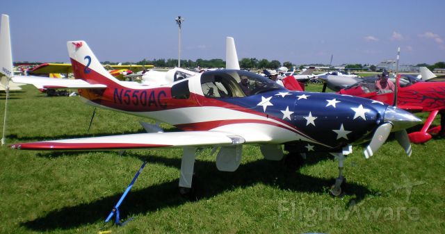 Lancair Legacy 2000 (N550AC) - N550AC is a 2008 Lancair Legacy shown on display at Oshkosh 2010. This Legacy sports a Stars&Stripes paint job similar to TWO other Lancairs N27RM and N948JT.