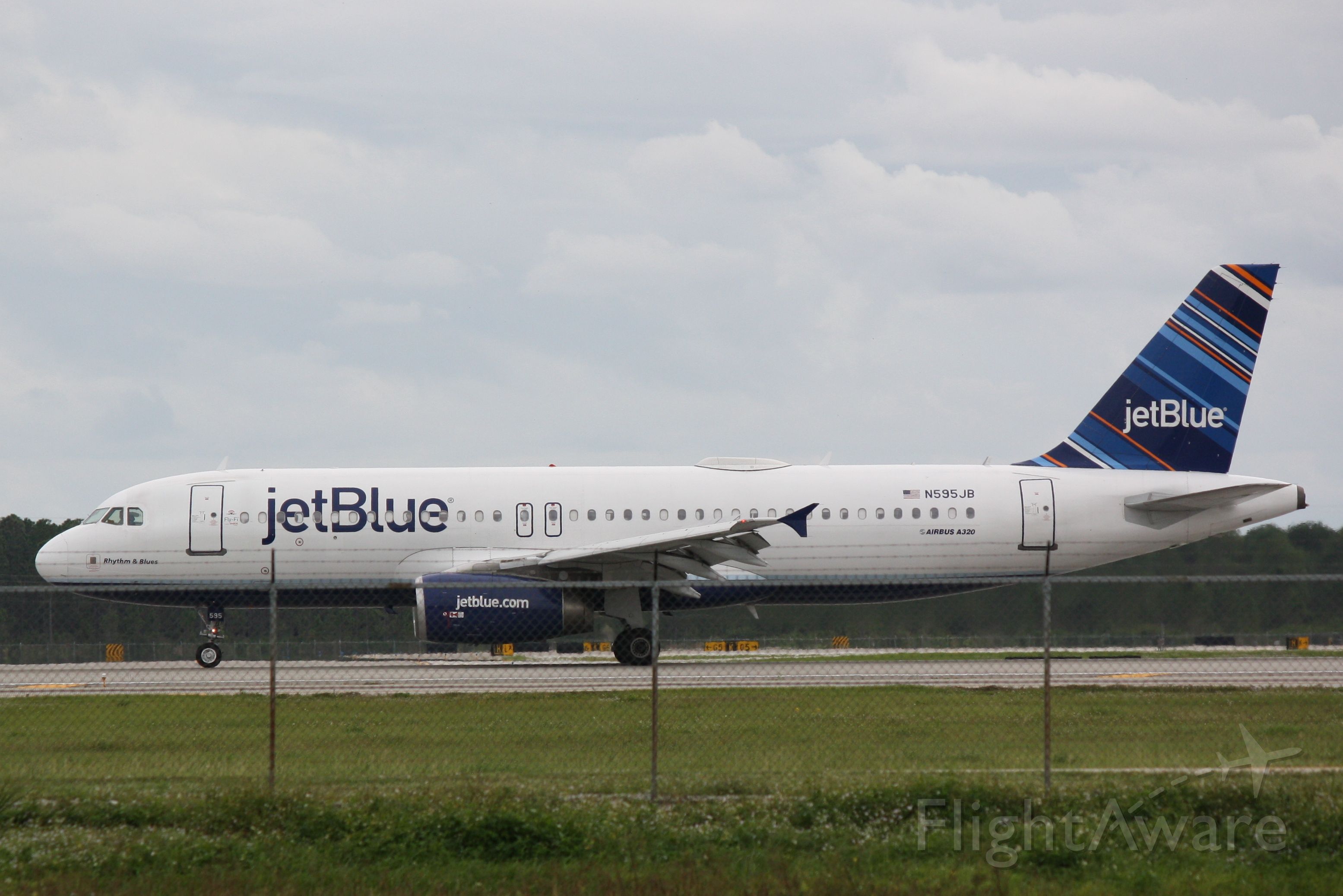 Airbus A320 (N595JB) - JetBlue Flight 1129 (N595JB) "Rhythm & Blues" arrives at Southwest Florida International Airport following flight from John F Kennedy International Airport