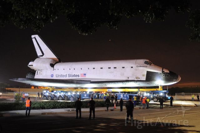 — — - Shuttle Edeavour shortly after departing LAX.