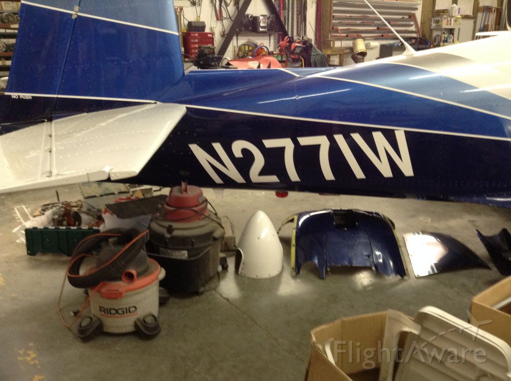 Mooney M-20 (N2771W) - In the shop for new jugs.
