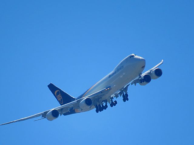 — — - The is the best still image from plane spotting this morning. This is a UPS 747-800 on a direct great circle flight from  Cologne, Germany. She is making a turn to line up with the glide path to runway 35R. The runway glidepath is right over my home, Hillview KY, USA