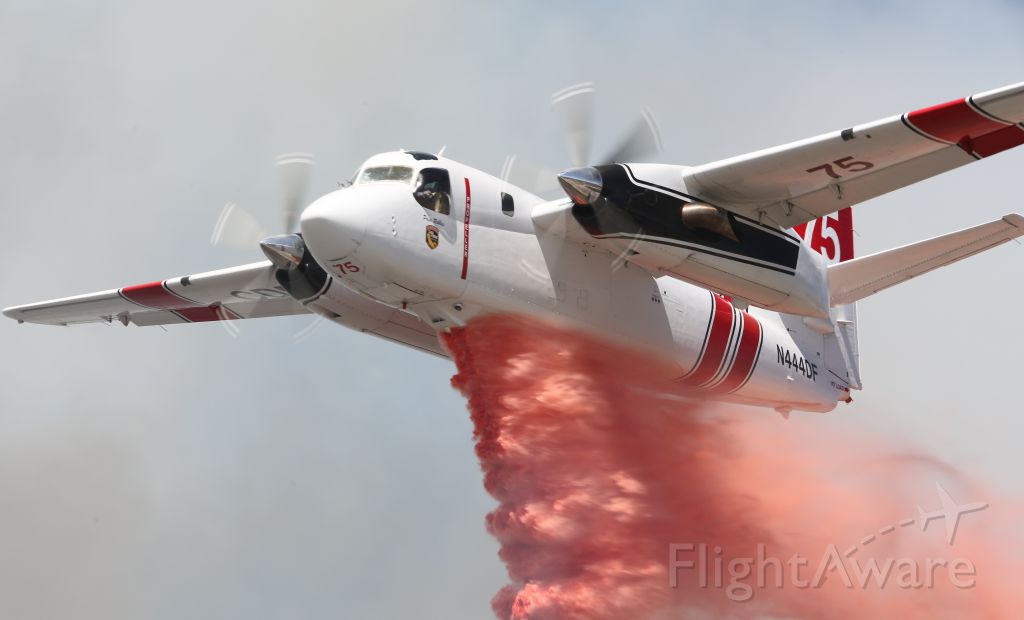 Experimental 100kts-200kts (N444DF) - California Department of Forestry Tanker 75 drops flame retardant on a vegetation fire in Oceano, CA on July 15. Tanker 74 & 75 are based out of Paso Robles Muni airport during current fire season. I was covering fire for the Five Cities Fire Authority. CDF air attack equipment is available through mutual aid agreement.