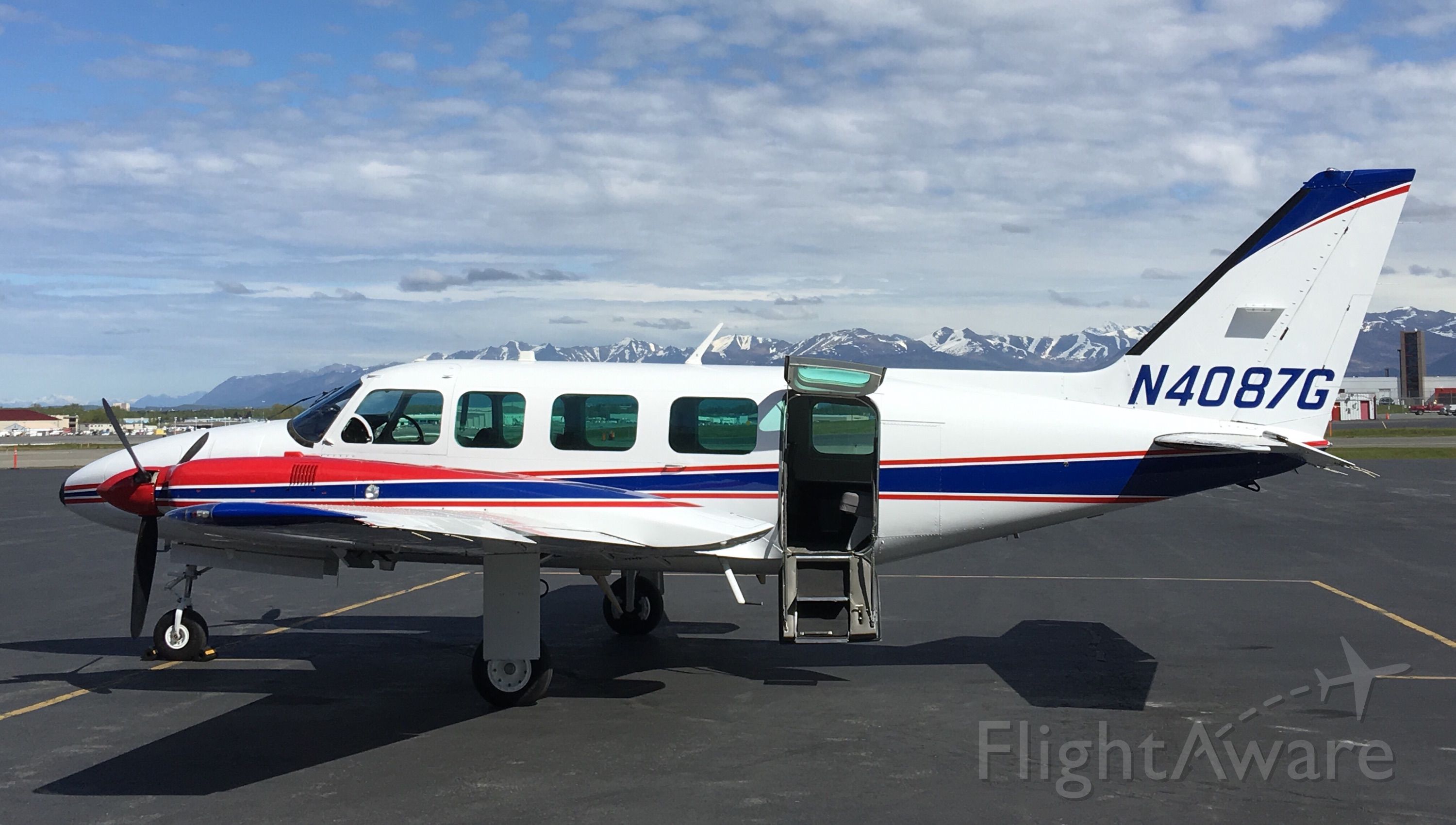 Piper Navajo (SVX37) - On the Security Aviation ramp at PANC facing the Chugach Mountains