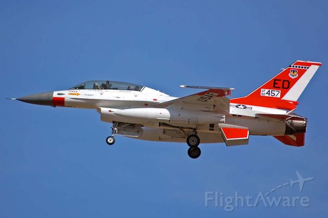 Lockheed F-16 Fighting Falcon (92-0457) - General Dynamics F-16B Block 15AS OCU Fighting Falcon 92-0457 of the 412th Test Wing made a touch and go landing on Runway 25 at Air Force Plant 42 in Palmdale, California just before 10:00 in the morning on February 2, 2006. It was ordered by Pakistan in the early 1990s. Due to technology transfer restrictions, the order of F-16s was embargoed. This F-16B was stored at AMARC for several years before being assigned to the 412th Test Wing at Edwards Air Force Base. The embargo was lifted in 2006 and this F-16 was delivered to the Pakistan Air Force on July 28, 2008 as 94623. 