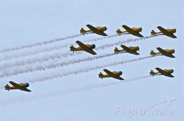 North American T-6 Texan (C-FVMG) - C-FVMG and the 9 plane squad of T-6s in a low and over fly past at the 40th Anniversary Hamilton AirShow, June 2012.