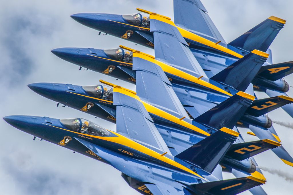 McDonnell Douglas FA-18 Hornet — - This photo is from the VERY FIRST performance where the Blue Angels debuted the FA18 SUPER HORNET as their new aircraft. I personally really love this photo and I hope everyone else does as well. The symmetry is about as perfect as possible. You can clearly see the Commander in the number 1 aircraft looking ahead and the other three pilots are concentrating on the aircraft to their left.The show was at the Sun N Fun aerospace expo in Lakeland Florida April 2021. I used 600mm of Canon lens and the camera settings were 1/8000 F5.6 ISO 800. Please check out my other photography. Positive votes and comments are always appreciated. Questions about this photo can be sent to Info@FlewShots.com