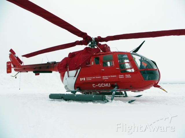 PADC BO-105 (C-GCHU) - C-GCHU, a Canadian Coast Guard Messerschmitt-Bölkow-Blohm Bo 105 sitting in the snow with  engine and blade covers. Sept-Iles, Quebec - January 2014