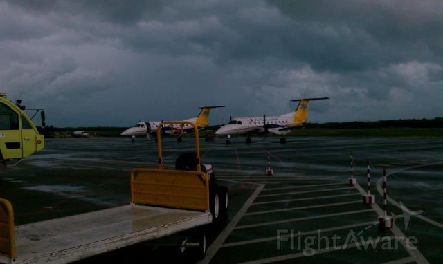 Cessna 402 (VQ-TDG) - Air Turks & Caicos Embraer 120s VQ-TMJ AND VQ-TDG STORMY day in the islands.