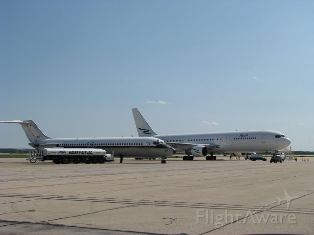 N117 — - USN C-9 and Ryan Internationals newest B767-300 share the ramp on a beautiful Sunday at RFD. The C-9 was picking up the Marine Corps Silent Drill Team Platoon.