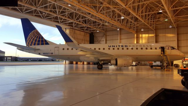 Embraer 170/175 (N89317) - Early morning in the hangar, just after sunrise.