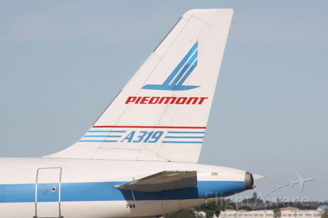 Airbus A319 (N744P) - US Air Flight 2090 (N744P) "Piedmont Heritage" prepares for flight at Sarasota-Bradenton International Airport