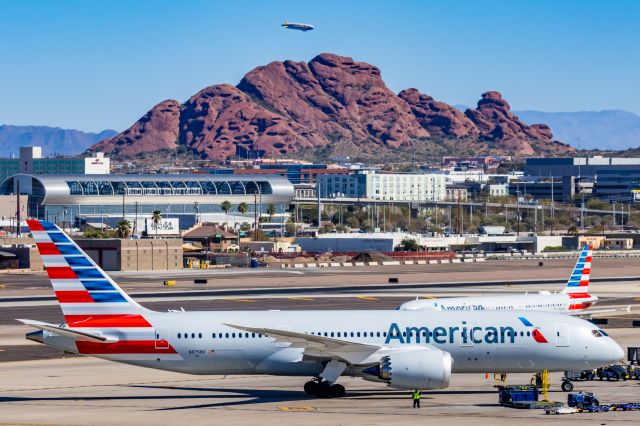 Boeing 787-8 (N875BD) - An American Airlines 787-9 taxiing at PHX with the Goodyear blimp in the background at PHX on 2/10/23 during the Super Bowl rush. Taken with a Canon R7 and Canon EF 100-400 II L lens.