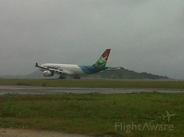 — — - This Air Seychelles flight came in after heavy rains and winds had hit the islands.  Taken with my Blackberry as she flew in for a safe landing despite the winds.