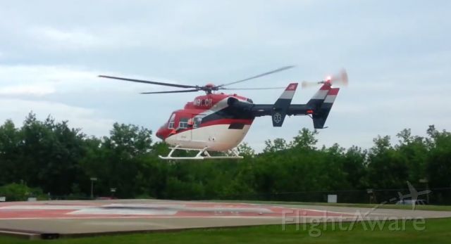 NUSANTARA NBK-117 (N911CH) - N911CH (1990 MBB BK117 B1, C/N 7223) lifting off from Central Maine Medical Center on Wednesday 8/6/2014