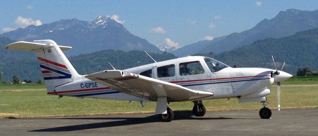 Piper Cherokee (C-GPSE) - Turbo Arrow IV at Chilliwack with the Coastal Mountains in the background.