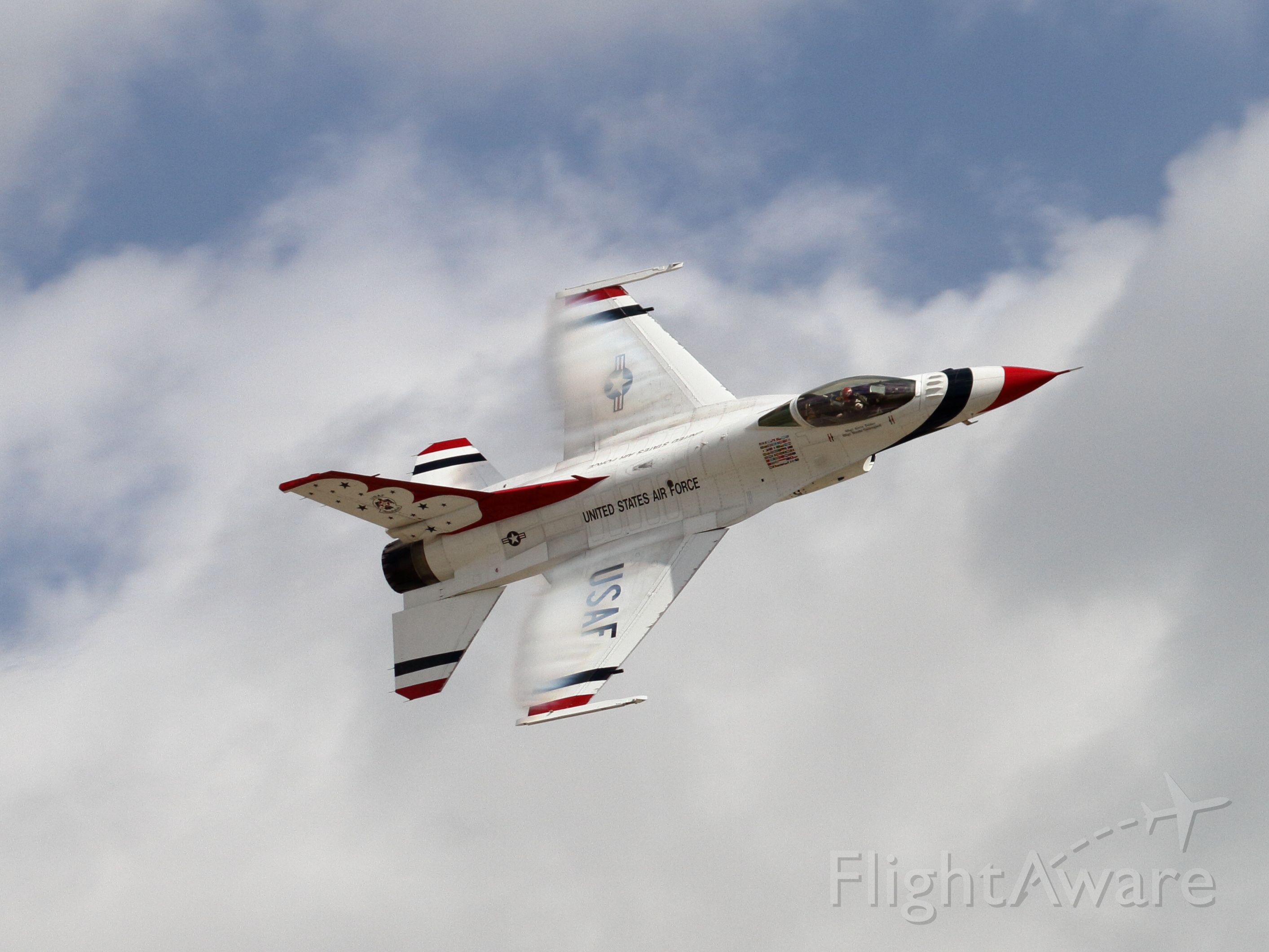 Lockheed F-16 Fighting Falcon — - Maj Alex Turner, USAF Thunderbirds Lead Solo - Travis AFB Wings Over Solano - 5/6/2017. Maj. Turner is executing a high speed "sneak" pass, just below the speed of sound. The crowds attention is on the diamond, which has just passed show center. Maj. Turner followed close behind, but because of his speed there was no sound until he was right at show center, hence the "sneak" pass.