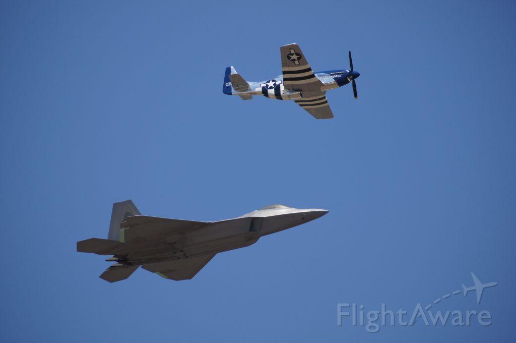 Lockheed F-22 Raptor — - Heritage Flight of F-22 and P-51 at Robins AFB. 29 April 2012.