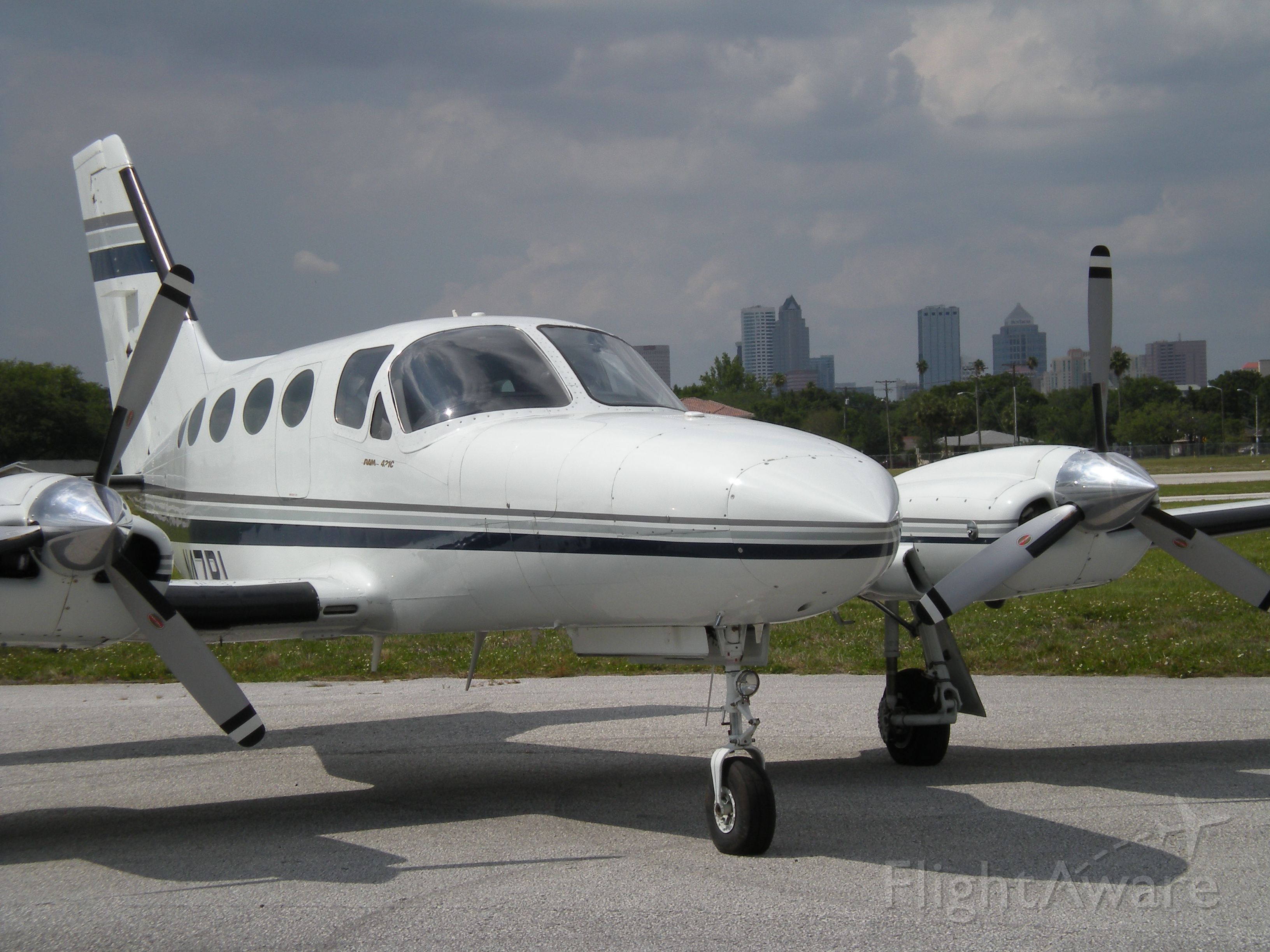 Cessna 421 (N47RL) - At the north end of Peter O Knight airport (KTPF) with downtown Tampa in the background.