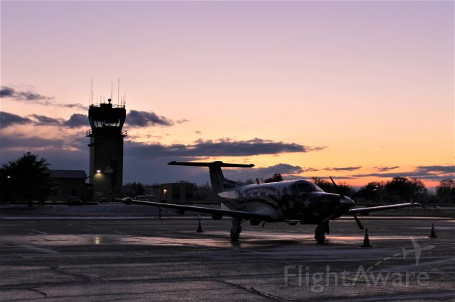 Pilatus PC-12 (N812PA) - The sun setting over Priority Air Charter's white American flag livery Pilatus after a brief snow squall. Jan. 2020