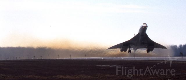 Aerospatiale Concorde (GN94AB) - When KJFK or KIAD and nearby alternates were down because of weather or other factors, the Concordes would fly to CYMX, Mirabel airport near Montreal for fuel.  This photo taken in January 1980 (notice that there is no snow on the ground) is of G-BOAB alias G-N94AB taking off on RWY 06 at YMX on a cold day.  The noise was so loud that my ears rang for a week...