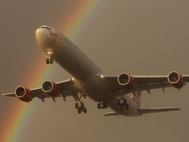 Airbus A340-600 — - Sometimes it's worth waiting through all the rain showers.