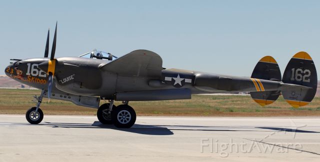 Lockheed P-38 Lightning (N138AM) - N138AM / NX138AM (originally USAAF 44-23314), a Lockheed P-38J Lightning painted in the markings of "23 Skidoo," a P-38H (USAAF 42-66504), taxies past the crowd at Travis AFB's "Wings Over Solano 2022" Open House and Air Show. It is owned by the Planes of Fame Air Museum in Chino, CA.