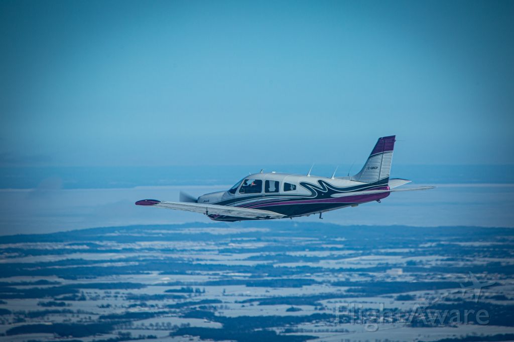 Piper Cherokee (C-GRCP) - Flying with Lake Simcoe in the background