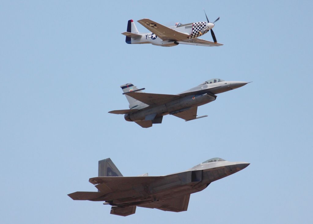 North American P-51 Mustang (N20TF) - P-51 flying with an F-16 and F-22.