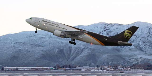 Airbus A300F4-600 (N157UP) - The sun is mere moments away from popping up into view from behind the Virginia Range Mountains as this UPS freighter points its nose skyward. When departing empty like this one, these Airbus heavies resemble rockets launching from the runway.