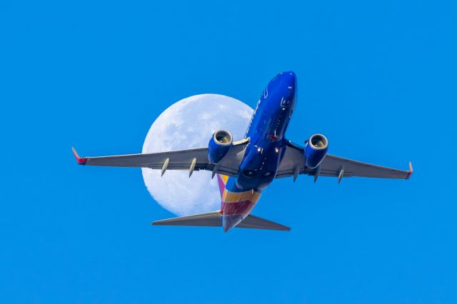 Boeing 737-700 — - Southwest Airlines 737-700 passing in front of the moon after taking off from PHX on 10/12/22. Taken with a Canon 850D and Tamron 150-600 G2 lens. It took me weeks to get a shot of a direct transit, and I’m happy that it finally happened! 