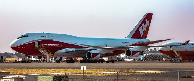 Boeing 747-400 (N744ST) - Oct 2020. 944 744 SuperTanker sits quietly at McClellan with  its DC-10 counterpart behind. 944's current status hangs in the balance between being retrofitted to cargo or someone using it as its current intended use.