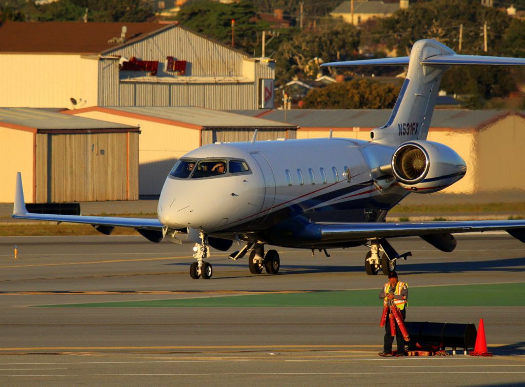 Bombardier Challenger 300 (N531FX) - KMRY - 31FX rolling off the main runway to the hard stand at Del Monte Aviation for the ATT Pebble Beach National Golf Tournament 2015.