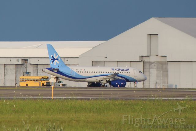 Sukhoi Superjet 100 (XA-JLG) - InterJet's first SSJ sits on the ramp at Bangor Maine on its delivery flight. SN 95023, the plane is the second in the production series. It is enroute Mexico to begin revenue service following an appearance at the Paris Air Show.