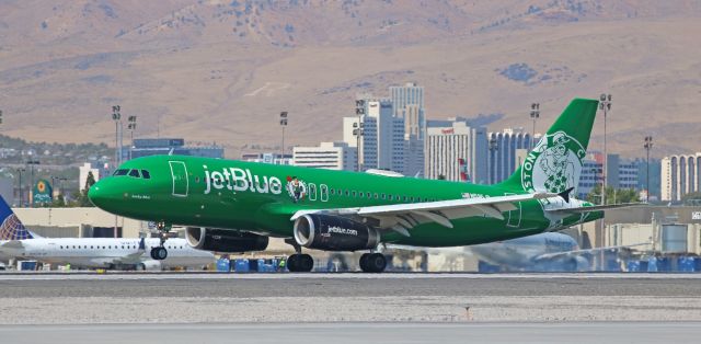 Airbus A320 (N595JB) - The Boston Celtics visit Reno! br /Over the past week, jetBlue has sent three special livery birds here. The only problem is that JBUs two flights here each day are at the worst possible times for photography: the daily Long Beach-Reno-Long Beach (KLGB-KRNO-KLGB) flight occurs during the noon hour when the sun is shining straight down and the temperatures on the airport are the hottest of the day, and the nightly KJFK-KRNO-KJFK trip arrives and departs Reno during the late evening hours. This click captured JBUs "Lucky Blue," the Boston Celtics special schemebird, as it touched down on 16R at 35 minutes past noon.
