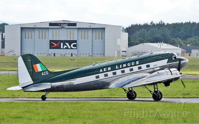Douglas DC-3 (ZS-NTE) - aer lingus dc-3 ei-acd arriving in shannon and was painted in the iac hanger in the background 22/7/17.