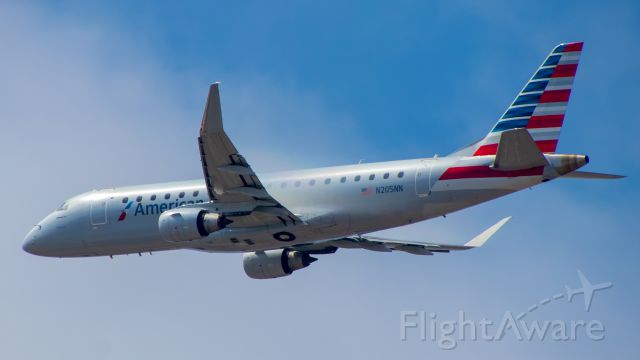Embraer 175 (N205NN) - A E175 of American doing a go around at LAX and making some vapor on the climb out.