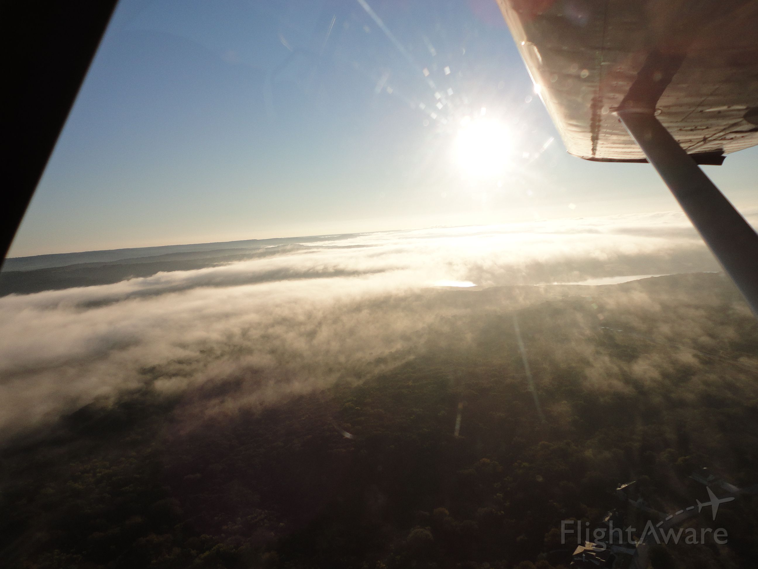 — — - Early Morning departure with fog over Lake Travis.
