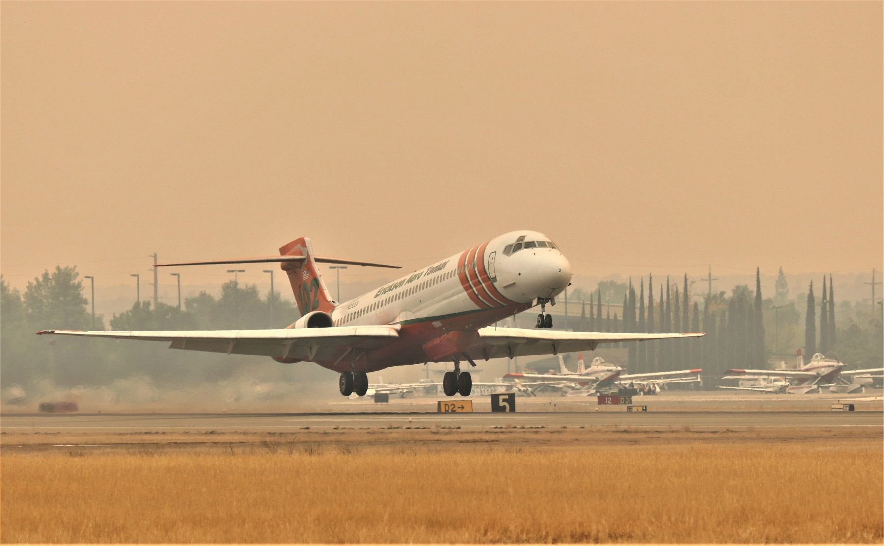 McDonnell Douglas MD-87 (N292EA) - KRDD Sept 29 2020 Erickson Aero Tanker 102 departing for the ZOGG Fire burning west of Redding CA USA The northern CA area was covered in smoke like this for most of 3 months this year 2020.