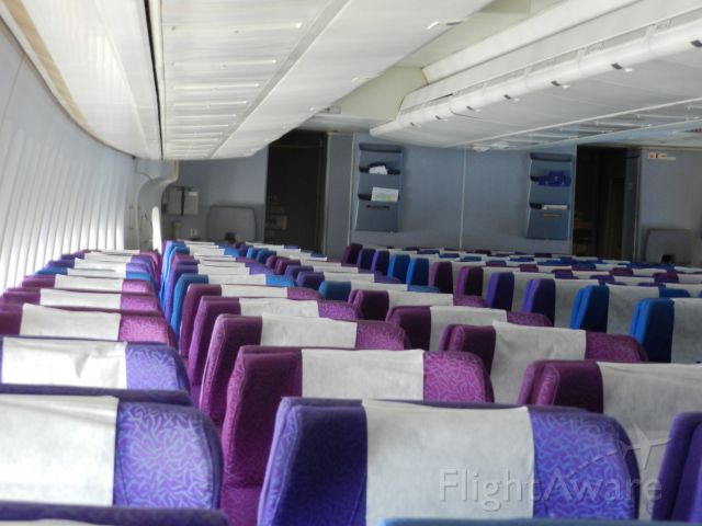 Boeing 747-200 (TF-AMV) - somewhere between Jeddah  and Batham , indonesia , this is the rear-right side of the coach class cabin , note the seat colors , previousely owned by Singapore Airlines and they kept the seats configuration an colors