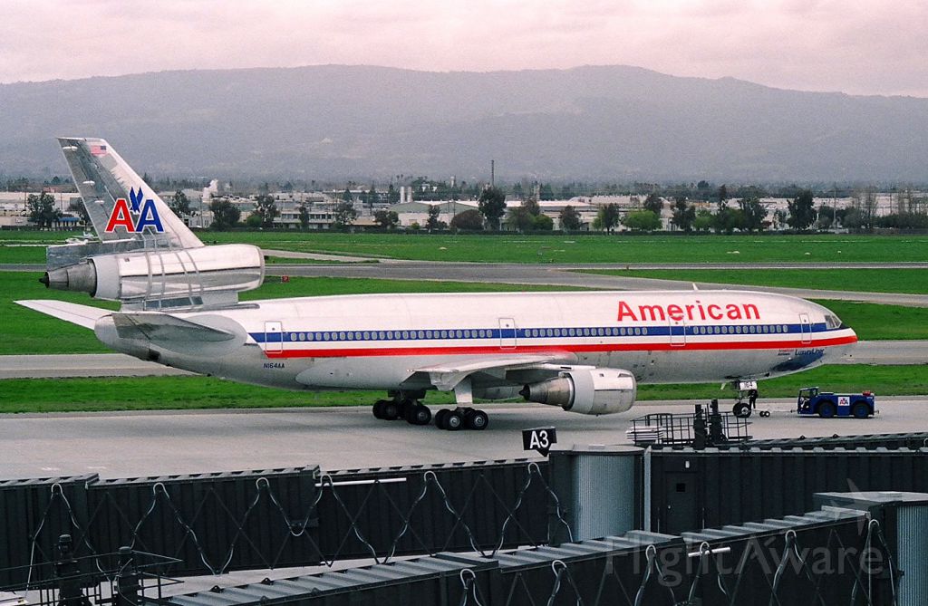 McDonnell Douglas DC-10 (N164AA) - KSJC - early 1990s of an American Airlines DC-10-30 getting set to depart to Tokyo-Narita. This was way before the Boeing 777 arrived and replaced the MD-11s!. Photo from atop the parking garage.