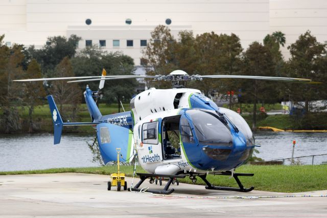 KAWASAKI EC-145 (N135FH) - AdventHealth Flight 1 helicopter sitting at the heliport of the AdventHealth hospital of Orlando.