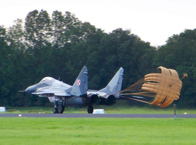 — — - Polish MiG 29 at Dutch air base Volkel during Luchtmachtdagen, September 2011. I still hear the noise and see the black smoke coming from the two huge exhausts.