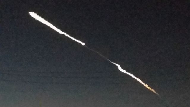 — — - space-x falcon 9 launch from vandenberg, ca 12-22 as seen from huntington beach, ca parking lot 
